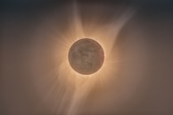 The sun’s corona glowing softly during a solar eclipse, revealing delicate plasma loops.