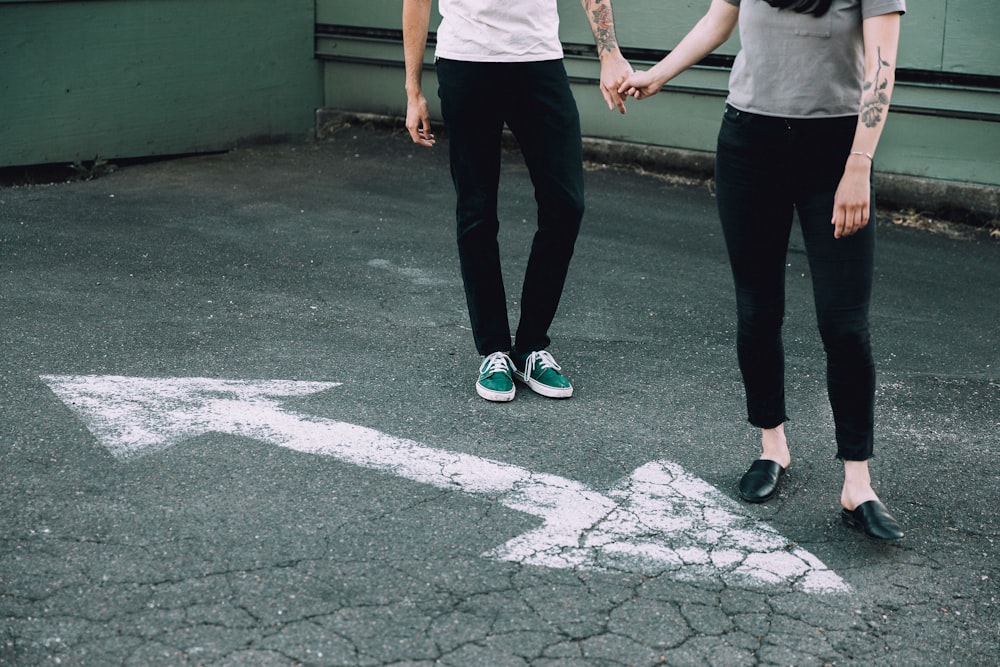 man and woman holding hands