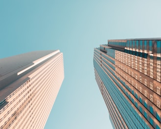 worm's eye view of skyscrapers growing into the sky