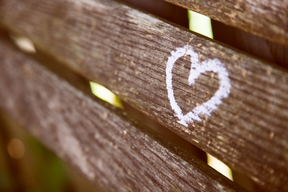 brown wooden panel with white heart