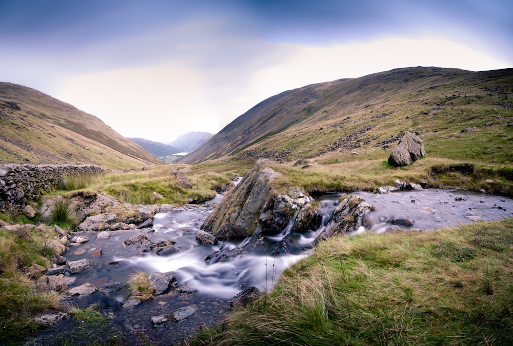 time-lapsed photography of stream during daytime