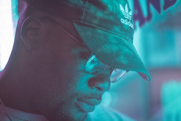 A calm, professional portrait of a coach in a softly lit, minimalistic office setting.