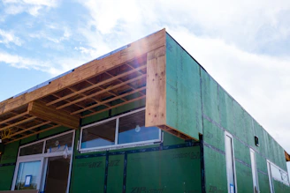 green wooden building during daytime