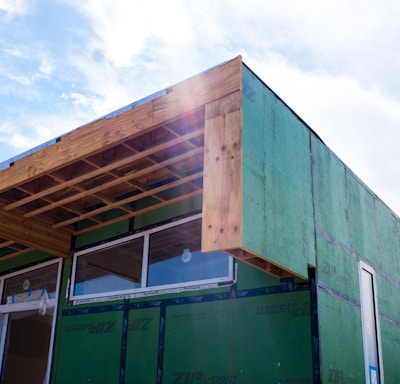 green wooden building during daytime