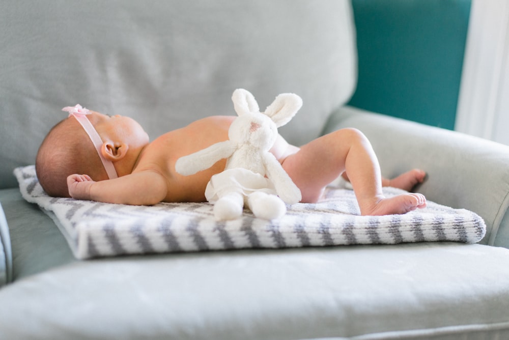 baby on white and gray mat