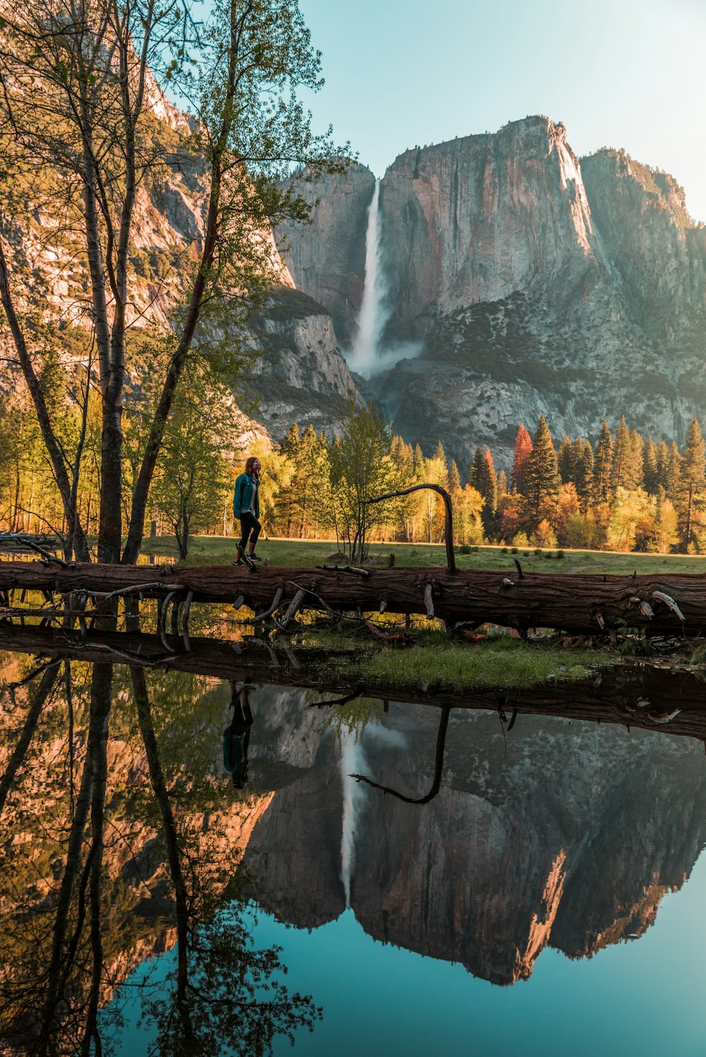 person walking near body of water