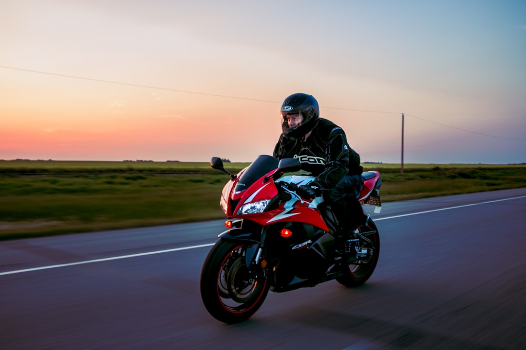 man riding sports motorcycle on road, Pin It