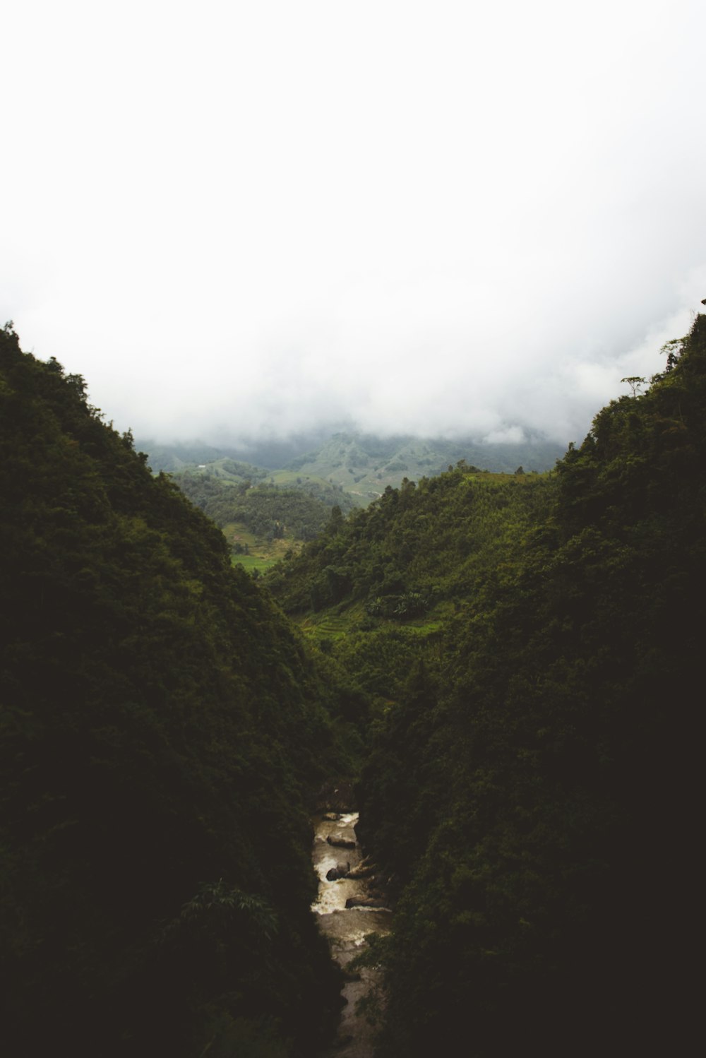 river running between mountains