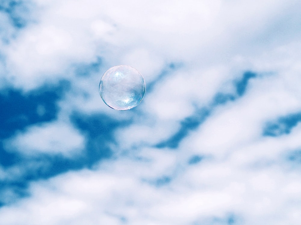 bubble under white clouds at daytime