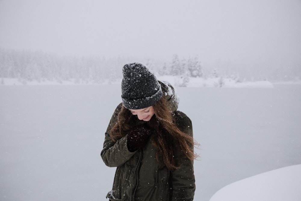 closeup photo of woman wearing black coat during winter