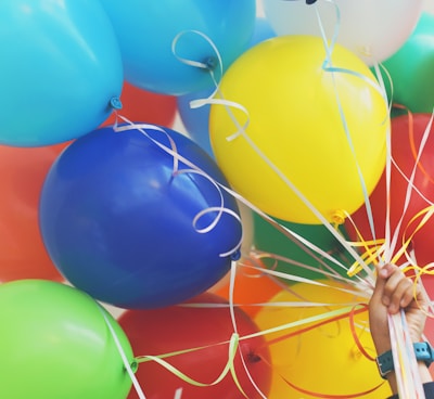 person holding balloons