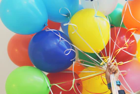 person holding balloons