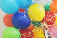 Children celebrating with colourful balloons