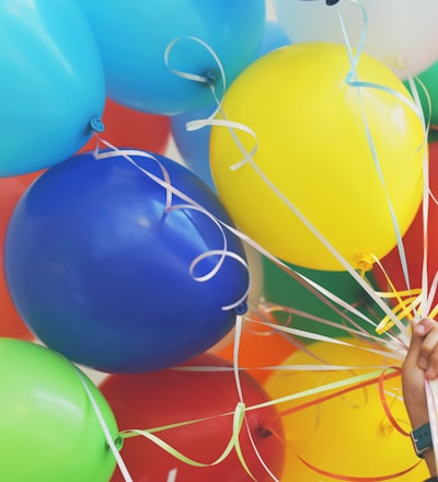 person holding balloons