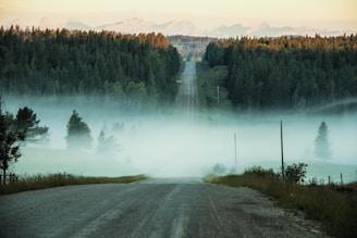photo of concrete road towards mountain