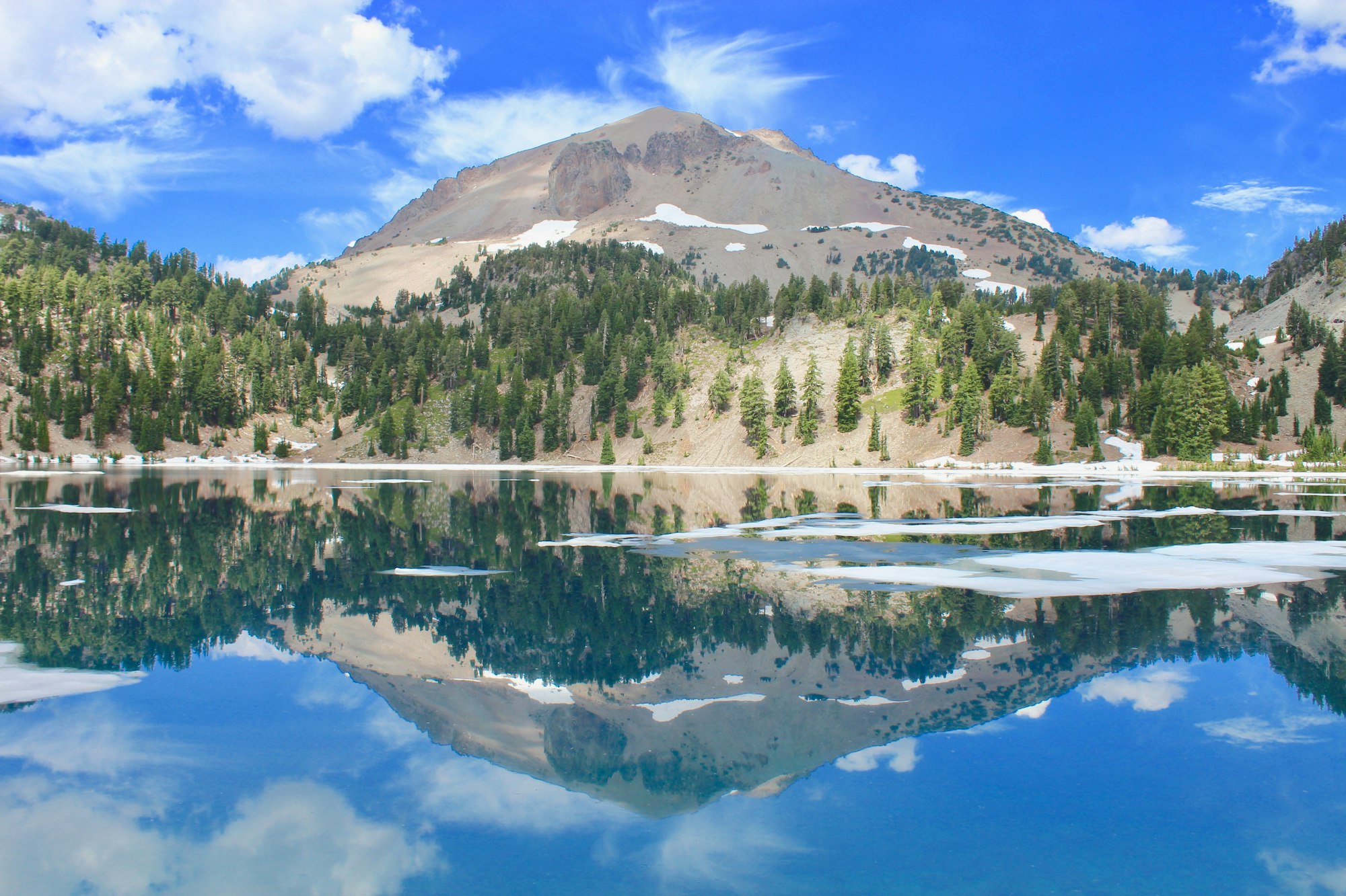 I was traveling around Lassen Volcanic National Park for a few days, and each day I went back to this spot because it would look drastically different throughout the day and I was captivated by it. First I took all the photos with my GoPro, but when I saw the lake this time it was so calm and simple and I wanted a smoother shot and thought I would use my DSLR.