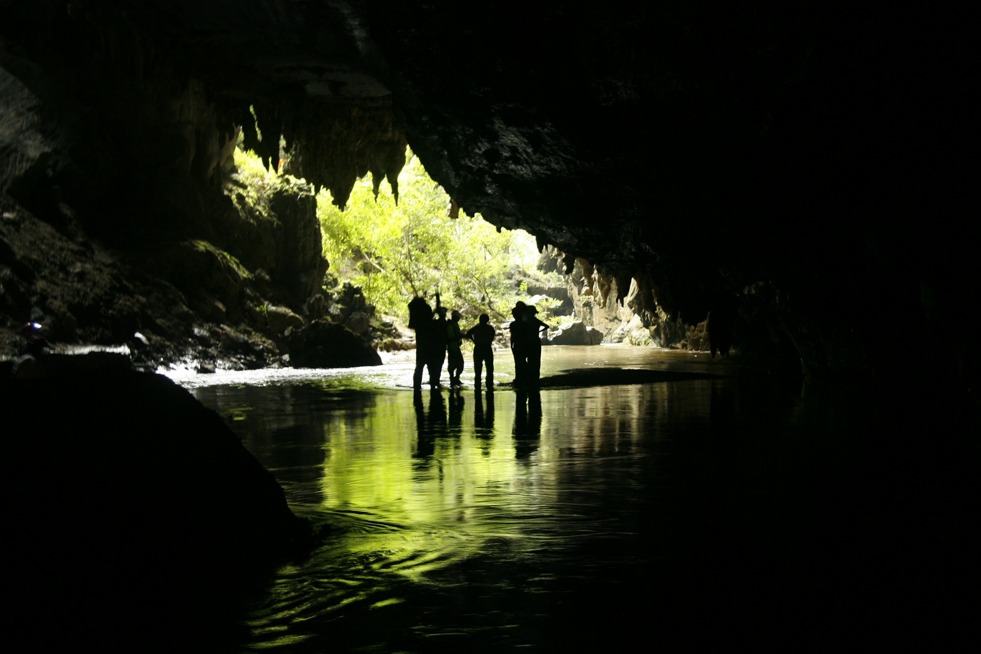 woman wearing yellow long-sleeved dress under white clouds and blue sky during daytime