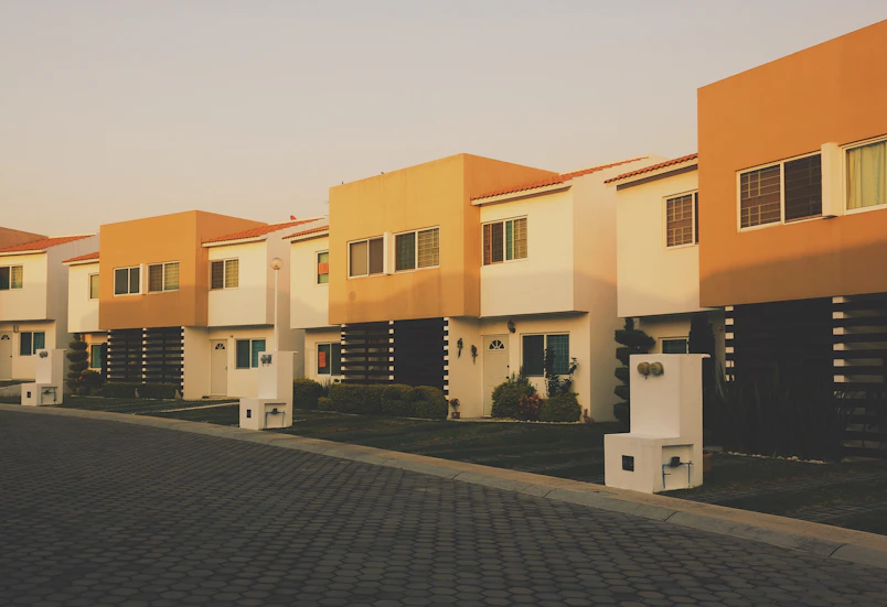 white and orange painted residential building
