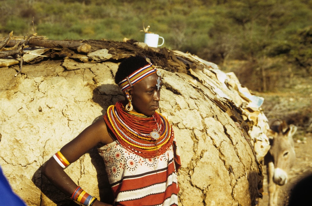 woman standing in front of rock formation