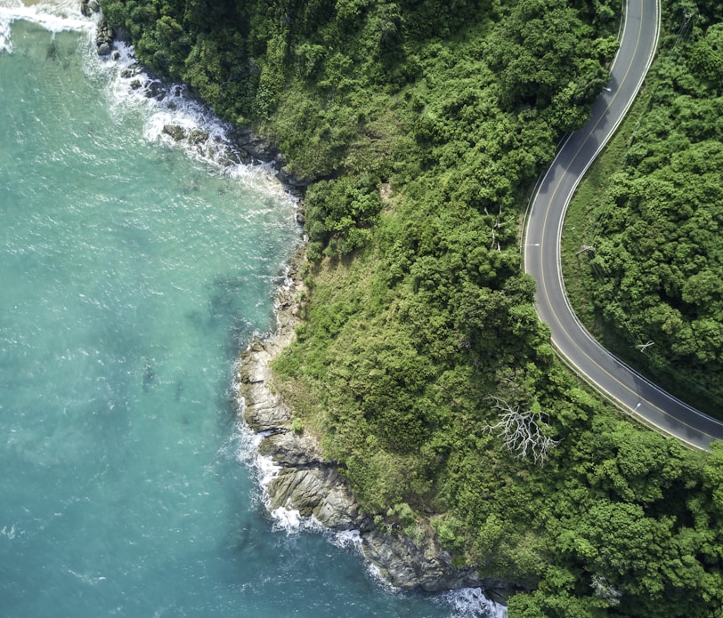 bird's eye photography of road near near body of water