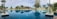 A luxurious villa with a stunning pool surrounded by palm trees in Dubai.