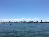 A panoramic shot of Lake Xolotlán with boats and the city skyline in the background.