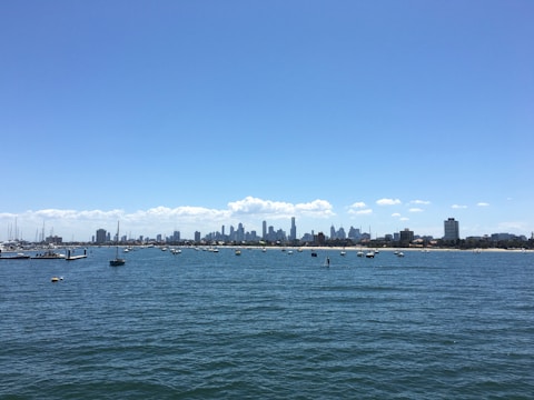 A panoramic shot of Lake Xolotlán with boats and the city skyline in the background.