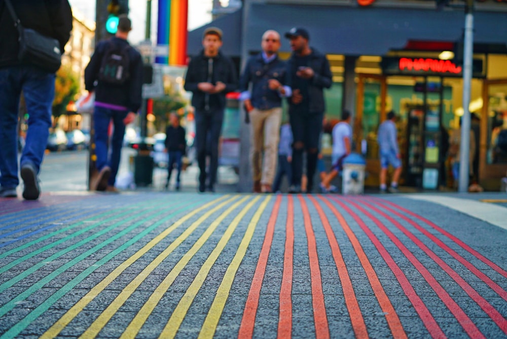 shallow focus photography of people walking on street