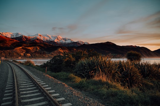train rail under blue sky in Kaikoura New Zealand