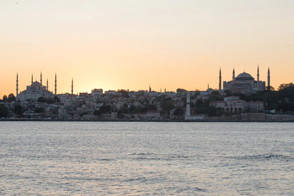 A peaceful sunset over a traditional Islamic city skyline.