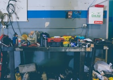 assorted-color handheld tools on work bench