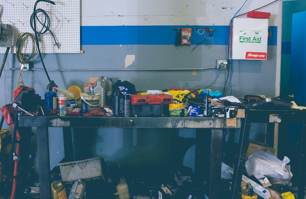 assorted-color handheld tools on work bench