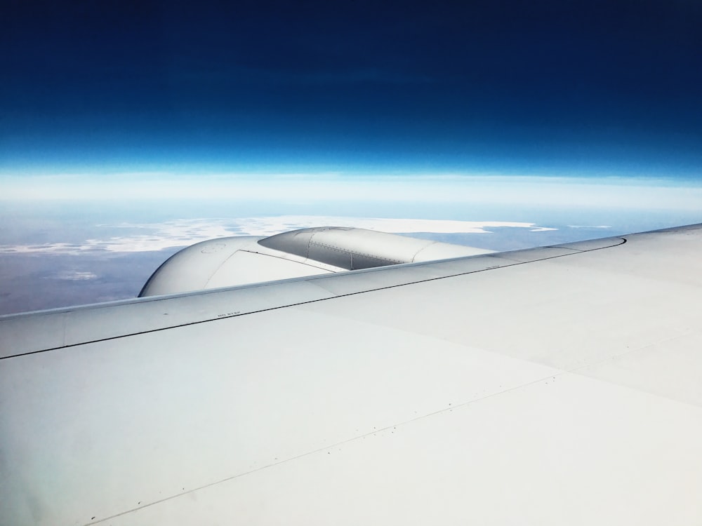 airplane wing under blue sky