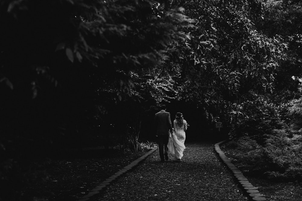 man and woman walking on street