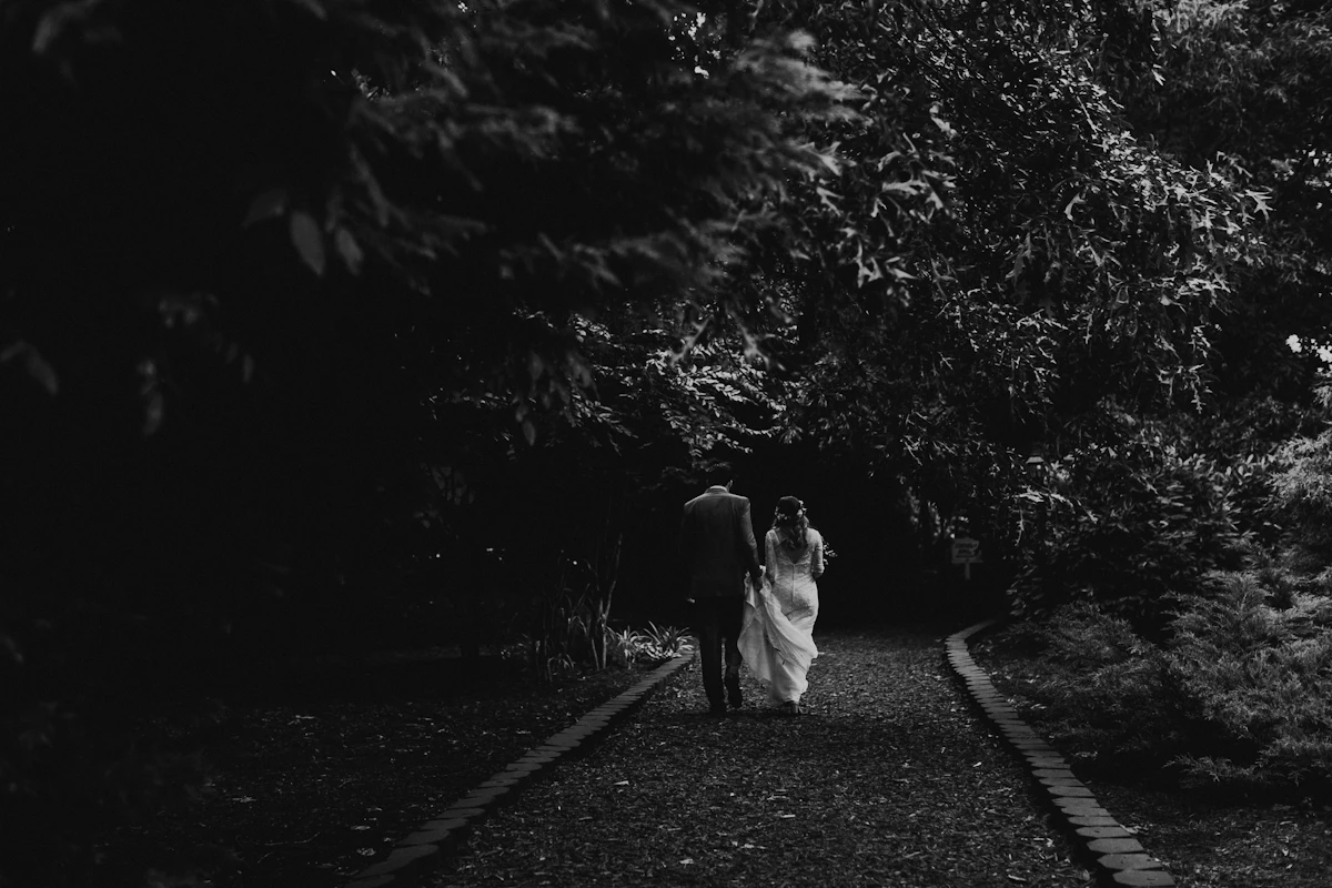 A man and a woman walking on a street