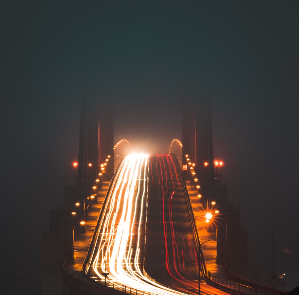 timelapse photography of bridge during night time
