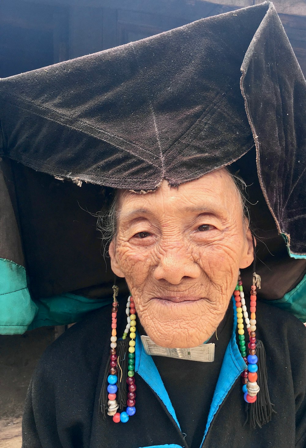 closeup photo of woman wearing black hat and dress