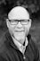 grayscale of man wearing eyeglasses