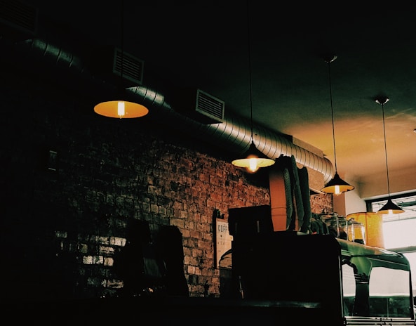 The interior of the café decorated with construction-themed elements and warm lighting.