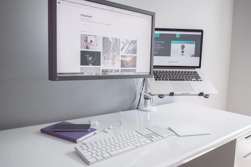 A sleek, minimalist workspace with a laptop displaying a clean website design.