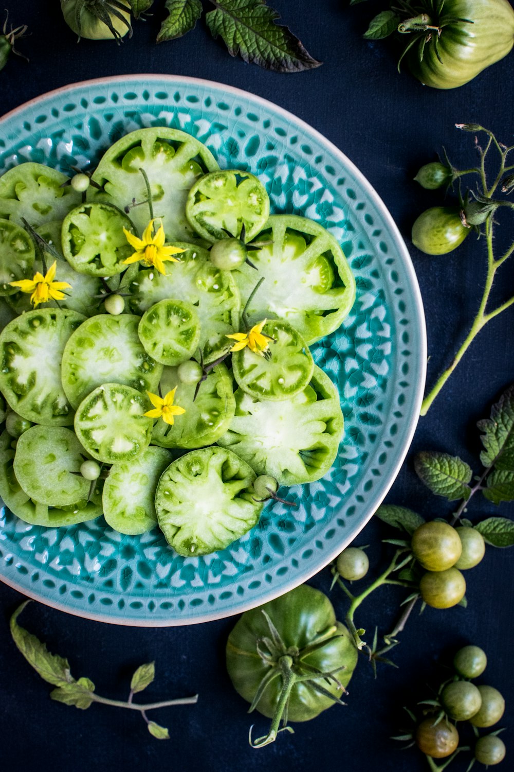 slices of green fruits on plate