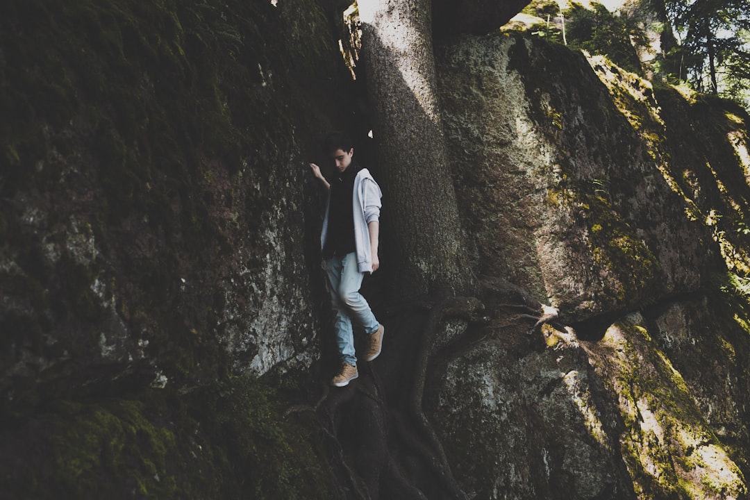 woman walking near rock