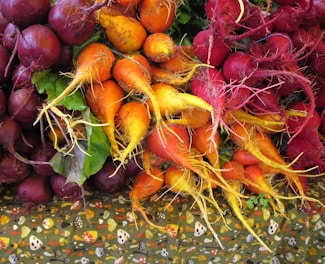 Sample packets of carrot and beetroot powder arranged on a clean white surface.