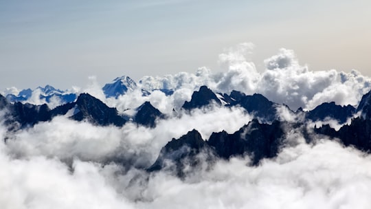 aerial photography of sea of clouds and mountain in Aiguille du Midi France