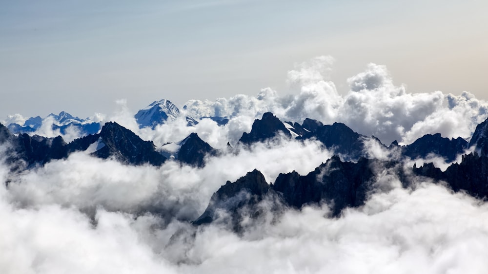 aerial photography of sea of clouds and mountain