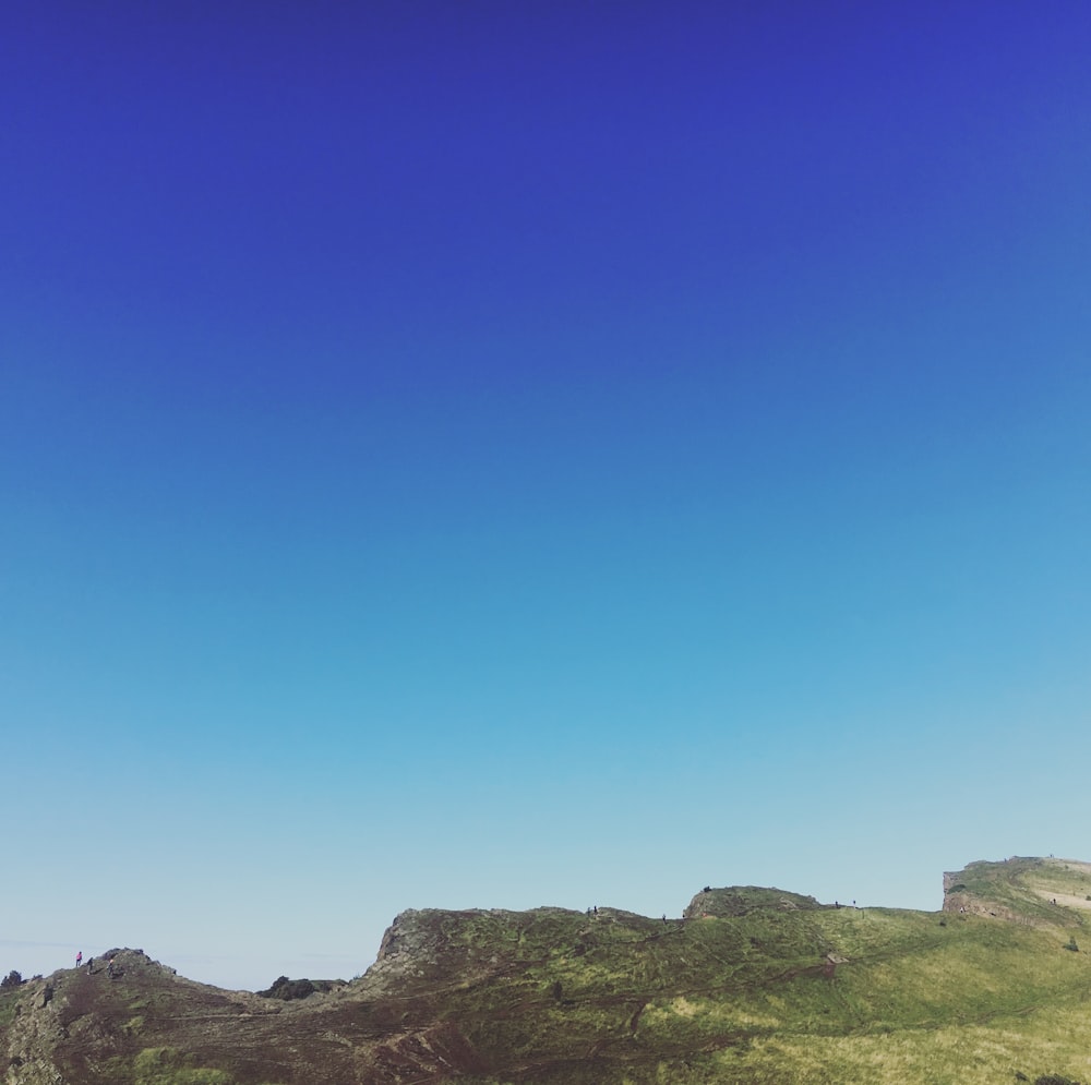 green and brown mountain under clear sky during daytime