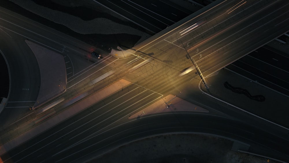 an overhead view of an intersection at night