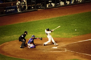 Close-up of a baseball batter mid-swing during a tense MLB game