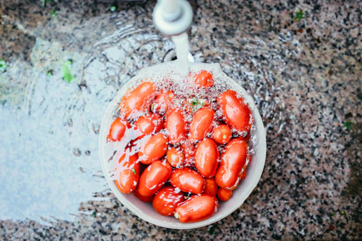 orange beans on white container soaked in water