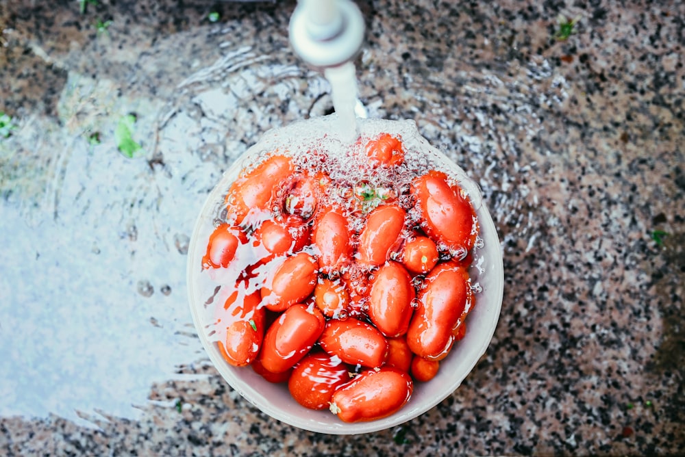 orange beans on white container soaked in water